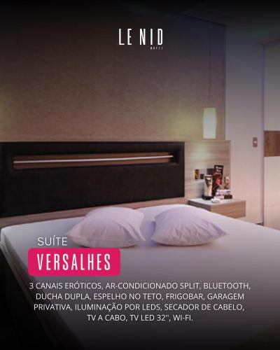 a poster of a bed in a bedroom at Le Nid Motel in São Paulo