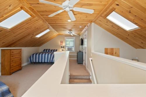 a living room with a ceiling fan and a couch at Eagle's Landing Private Dock Dog Friendly in Acton