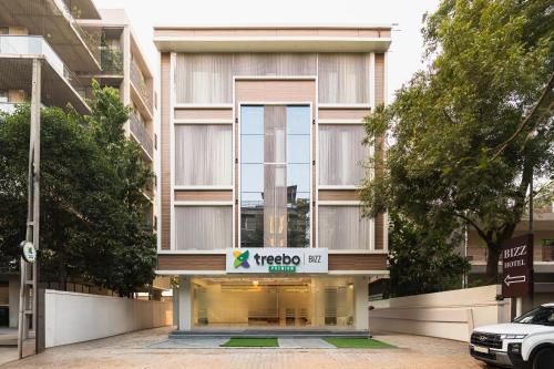 a building with a sign on the front of it at Treebo Premium Bizz in Ahmedabad