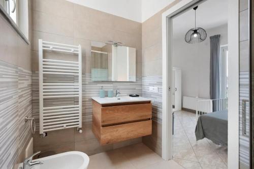 a bathroom with a sink and a mirror at GRIMALDI ROOMS Costa d'Amalfi in Pagani