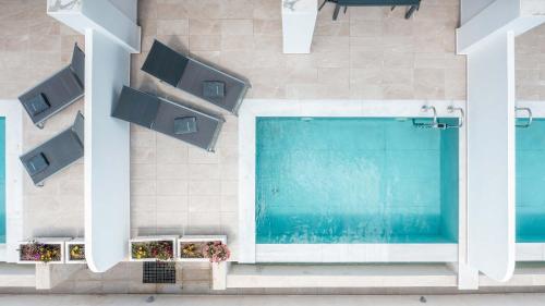 an overhead view of a swimming pool in a building at Punta Mare Villas in Karpathos