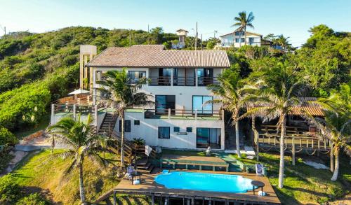 an aerial view of a house with a swimming pool at Mar Infinito Guest House in Arraial do Cabo