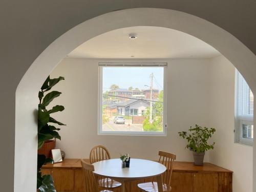a dining room with a table and a window at Suncheon Stay Rev in Suncheon