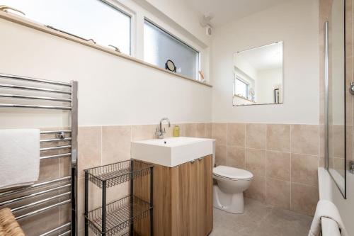a bathroom with a sink and a toilet at East Vows - Elie in Earlsferry