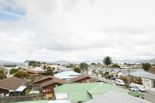 an aerial view of a town with houses at Quest Petone in Lower Hutt