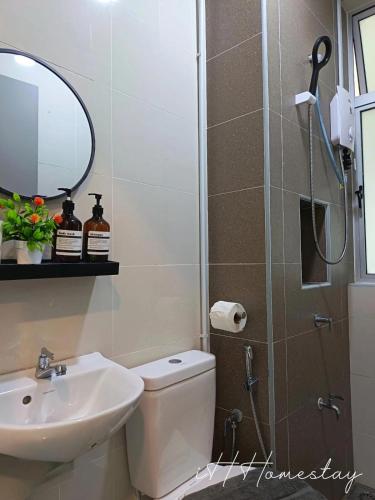 a bathroom with a shower and a toilet and a sink at Retro Game - D'Lagoon Sri Austin By iH Home in Kempas