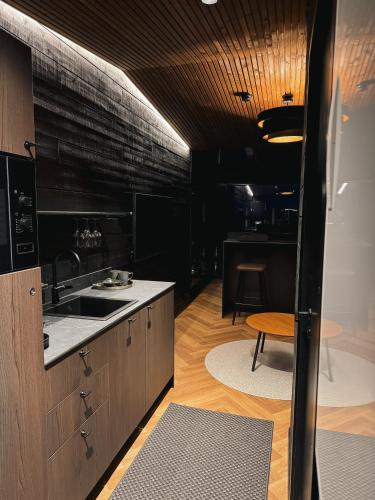 a kitchen with a sink and a counter at Arctic Lumo Resort in Kuusamo
