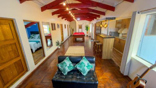 a living room with a couch in a tiny house at Apart Hotel de Alegria in Cusco