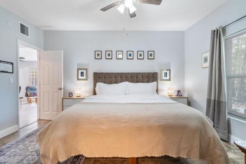a bedroom with a large bed and a ceiling fan at Shady Banks Oasis in Fort Lauderdale