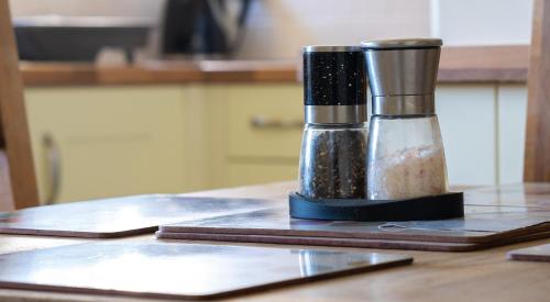 a container of spices sitting on a table at Crummock at the Graythwaite Estate in Sawrey