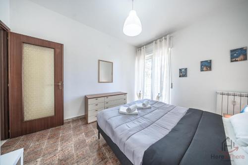 a bedroom with a large bed and a window at Mare & Comfort - Box Auto - Balcone - Free Wifi in Borghetto Santo Spirito
