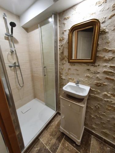 a bathroom with a shower and a sink at Gîte de Marcoux, authentic and warme house in Saint-Laon