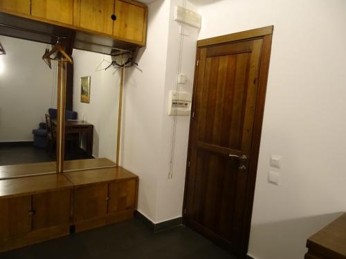 a room with a wooden cabinet and a door at Antiguo Palacio De Atienza in Atienza