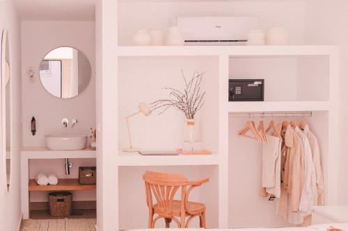 a white bathroom with a sink and a mirror at Casa Pacata, Beachside Escape in Labruge