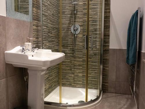 a bathroom with a sink and a shower at The Red Door in Bangor
