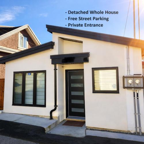 a detached window house with a free street parking private entrance at 2BR Detached Guesthouse - Free Parking -10 mins to YVR & Downtown in Vancouver