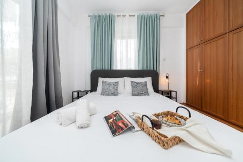 a bedroom with a bed with a tray of food on it at 2 bedroom flat in Strovolos