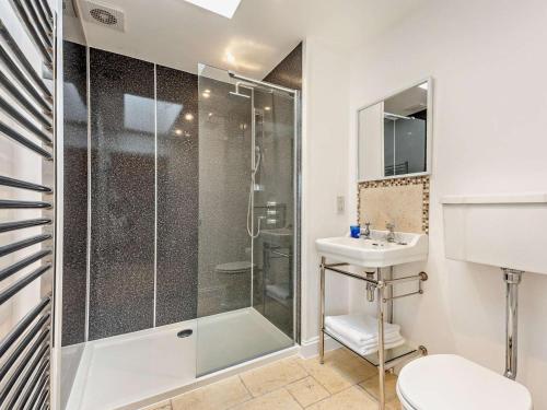 a bathroom with a shower and a sink at 2 Bed in Ventnor oc-88857 in Niton