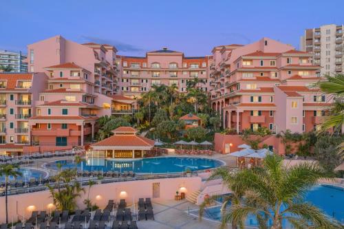 an aerial view of a resort with a swimming pool at Pestana Royal All Inclusive Ocean & Spa Resort in Funchal