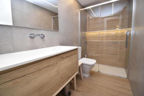 a bathroom with a sink and a toilet at Barocco Villa private pool in Santa Pola