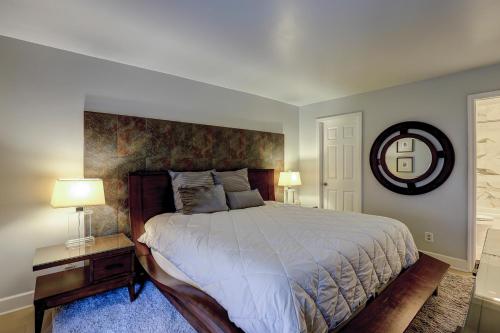 a bedroom with a large bed and a mirror at Clipper Court 814 in Hilton Head Island