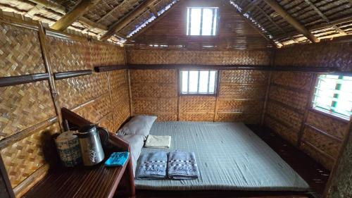 a small room with a bed and a table at Solaya Cove Private Resort in Bansud