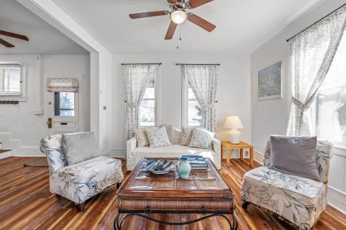 a living room with a table and two chairs at Broadway Cottage - Town, Hot Tub, Fire Pit, Grill, Wifi, Family Friendly, Pet Friendly in Berkeley Springs