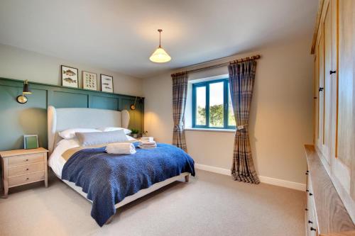 a bedroom with a bed and a window at 2 Bed in Builth Wells oc-bow198 in Builth Wells