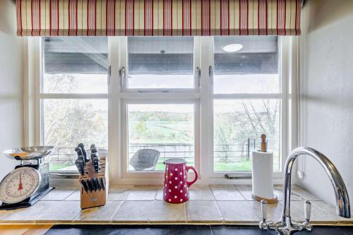 a kitchen with a window and a counter top at 4 Bed in Builth Wells oc-bow197 in Builth Wells