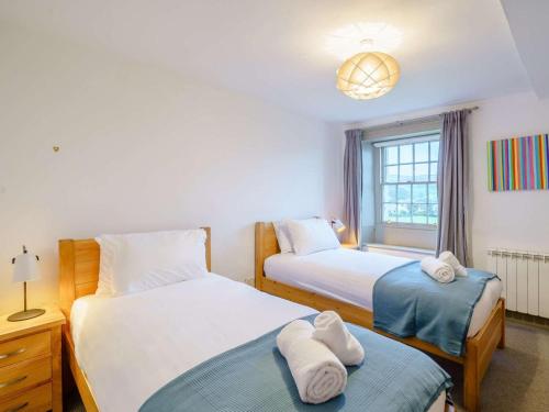 a bedroom with two beds and a window at 2 Bed in Cockermouth oc-86023 in Lorton