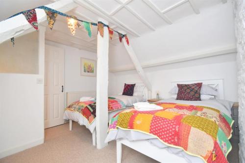 a bedroom with two beds and a loft bed at 2 Bed in Seaton oc-b27402 in Seaton