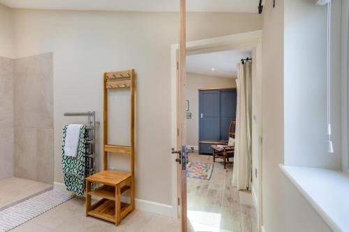 a bathroom with a walk in shower next to a hallway at 1 Bed in Ashton oc-p30484 in Ashton