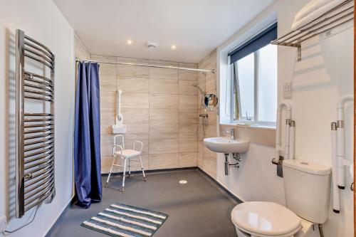 a bathroom with a toilet and a sink at 1 Bed in Blue Anchor oc-b28904 in Blue Anchor