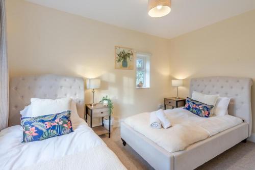 a bedroom with two beds and a couch at 3 Bed in Southwell oc-s30603 in Southwell
