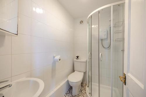 a bathroom with a toilet and a sink and a shower at 1 Bed in Berwick-upon-Tweed oc-b32029 in Kyloe