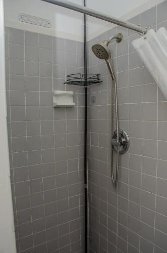 a shower with a shower head in a bathroom at Central location in Cutler Bay
