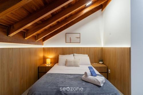 a bedroom with a bed with a book on it at Modern studio in Downtown Floripa CMA0101 in Florianópolis