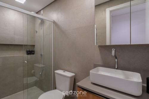 a bathroom with a toilet and a sink and a shower at Modern studio in Downtown Floripa CMA0101 in Florianópolis