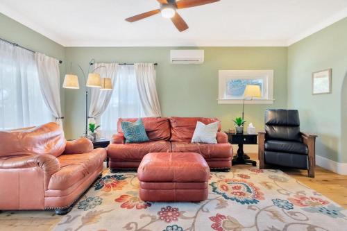 a living room with a couch and a chair at Home Squared-Downtown with Fire Pit in Paso Robles