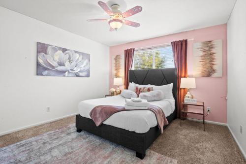 a bedroom with a bed and a ceiling fan at 1130 Mockingbird St in Brighton