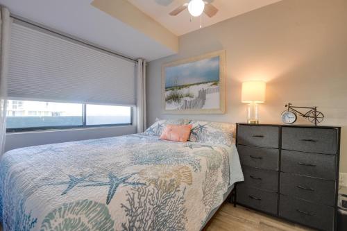 a bedroom with a bed and a dresser and a window at Beach, Pool & Ocean View! North Myrtle Beach Condo in Myrtle Beach
