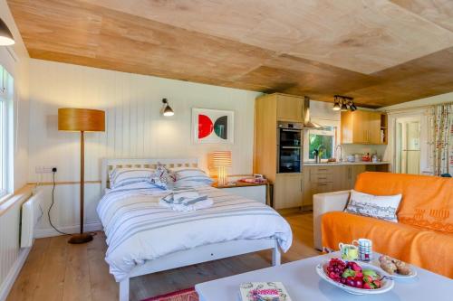 a bedroom with a bed and a living room at 1 Bed in South Hams oc-g31078 in Kingston