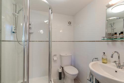 a bathroom with a shower and a toilet and a sink at 1 Bed in South Hams oc-g31078 in Kingston