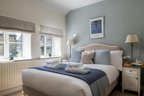 a bedroom with a bed with towels on it at 2 Bed in Baslow oc-h32721 in Baslow