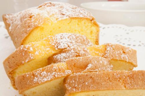 a piece of bread with powdered sugar on it at Ai Giardini di San Vitale in Ravenna