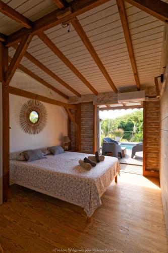 a bedroom with a large bed in a house at Makiese Resort in Saint-François