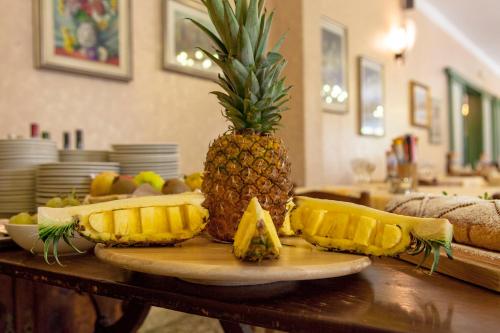 a pineapple sitting on top of a wooden table at Park Hotel Fantoni in Tabiano