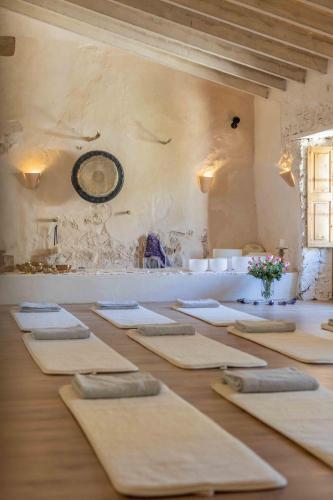 a room with a table with mats on it at Agroturismo Son Boronat in Calvià