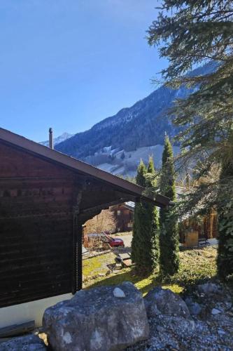 a barn with a view of a mountain at Apartment Châlet Hochmatt by Interhome in Im Fang