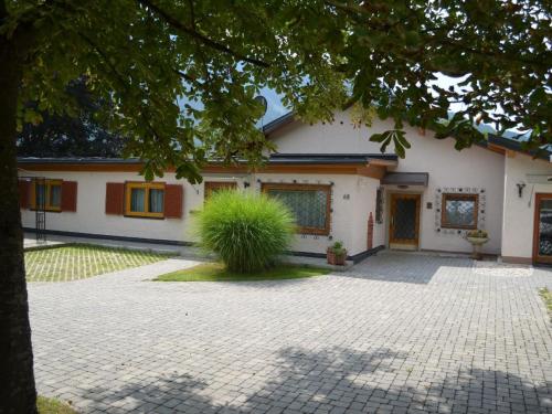 a house with a driveway in front of it at Apartment Erna Angermaier by Interhome in Flattach